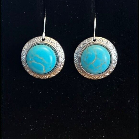 Handcrafted silver tone earrings with an turquoise colored stone. - Picture 1 of 4